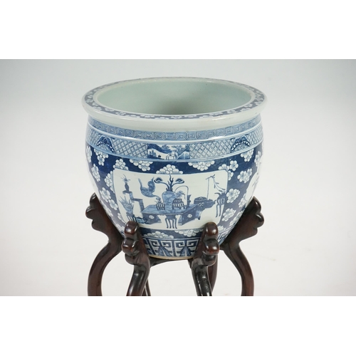 165 - A large Chinese blue and white Hundred Antiques jardinere and hongmu stand, late 19th/early 20th c... 