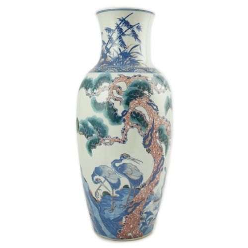 169 - An unusual Chinese underglaze blue and copper red longevity vase, 19th century, of elongated ovoid... 