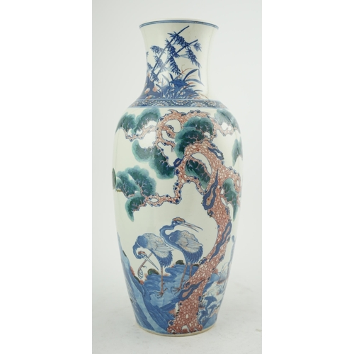 169 - An unusual Chinese underglaze blue and copper red longevity vase, 19th century, of elongated ovoid... 