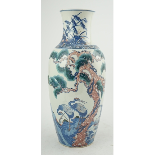 169 - An unusual Chinese underglaze blue and copper red longevity vase, 19th century, of elongated ovoid... 