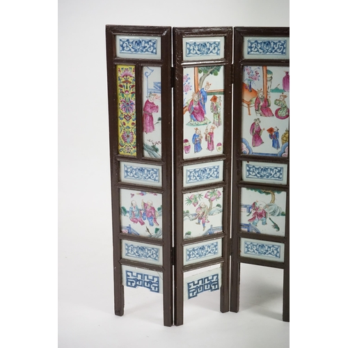 172 - A Chinese wood framed and porcelain mounted low screen, late 19th century, the four upper panels pai... 