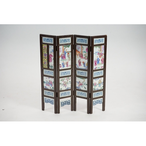 172 - A Chinese wood framed and porcelain mounted low screen, late 19th century, the four upper panels pai... 