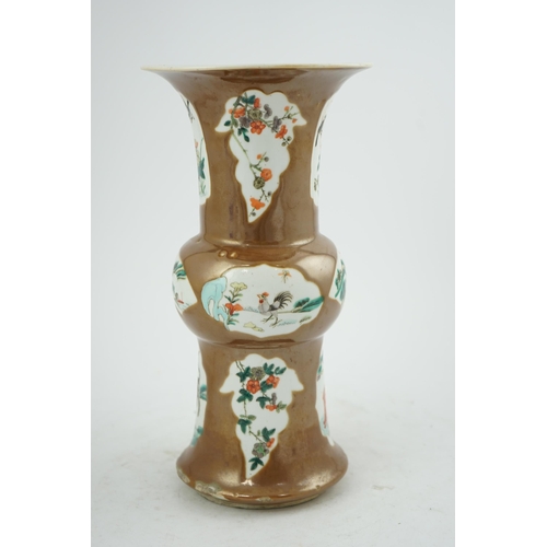 174 - A Chinese cafe-au-lait ground beaker vase, gu, 19th century, painted in famille verte palette with b... 