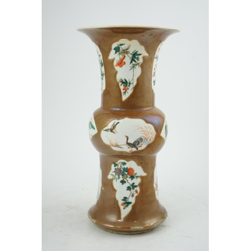 174 - A Chinese cafe-au-lait ground beaker vase, gu, 19th century, painted in famille verte palette with b... 