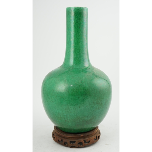 176 - A Chinese green crackle glazed bottle vase, 19th century, with white crackle glazed base, 41.5cm hig... 