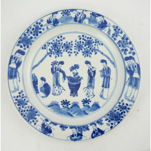 177 - A Chinese blue and white 'ladies' plate, Kangxi mark, 19th century, painted with four ladies in a ga... 