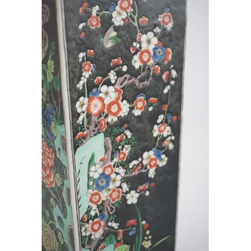 179 - A large Chinese famille noire square baluster vase, 19th century in Kangxi style, painted to each si... 