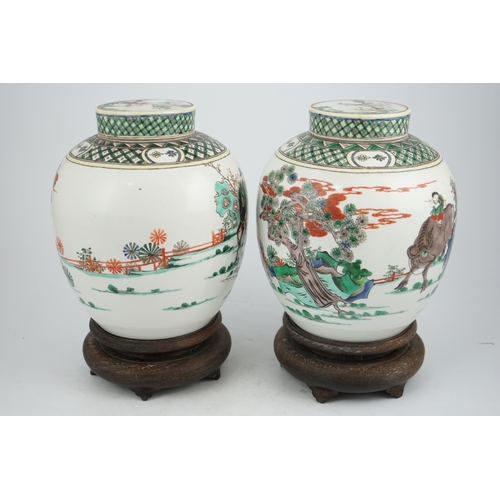 180 - A pair of large Chinese famille verte globular jars and covers, early 20th century, each painted wit... 