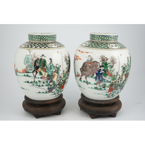 180 - A pair of large Chinese famille verte globular jars and covers, early 20th century, each painted wit... 