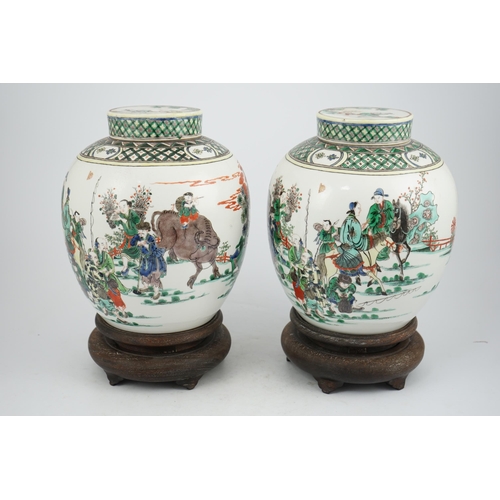 180 - A pair of large Chinese famille verte globular jars and covers, early 20th century, each painted wit... 