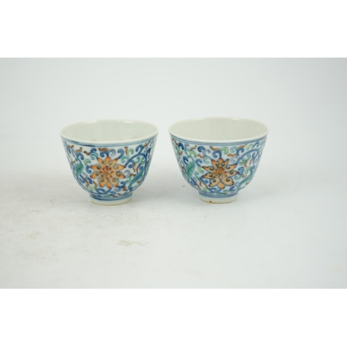 183 - A pair of Chinese doucai cups, Guangxu mark and period (1875-1908), each painted with lotus flowers,... 