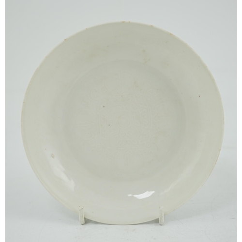 191 - A Chinese moulded white glazed saucer dish, Yongle mark, Republic period, the centre moulded with a ... 