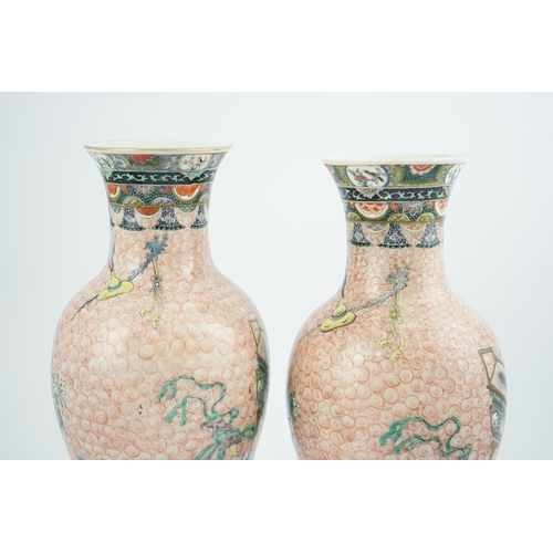 193 - A near pair of Chinese famille rose Hundred Antiques baluster vases, Kangxi mark, early 20th centu... 