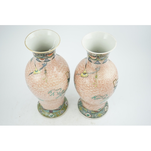 193 - A near pair of Chinese famille rose Hundred Antiques baluster vases, Kangxi mark, early 20th centu... 