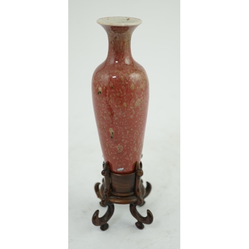 200 - A small Chinese peach bloom glazed vase with fitted wood stand, Republic period, underglaze blue Kan... 