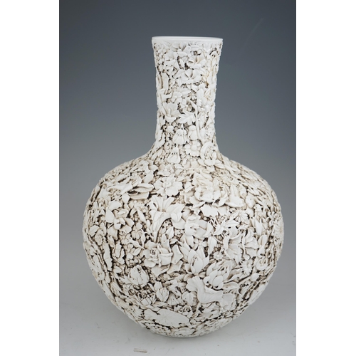 201 - A large Chinese carved porcelain thousand flower bottle vase, 20th century, intricately carved and... 