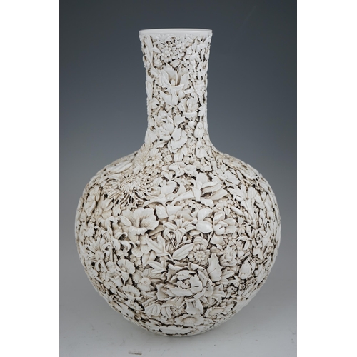 201 - A large Chinese carved porcelain thousand flower bottle vase, 20th century, intricately carved and... 