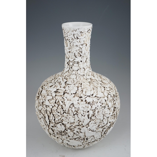 201 - A large Chinese carved porcelain thousand flower bottle vase, 20th century, intricately carved and... 