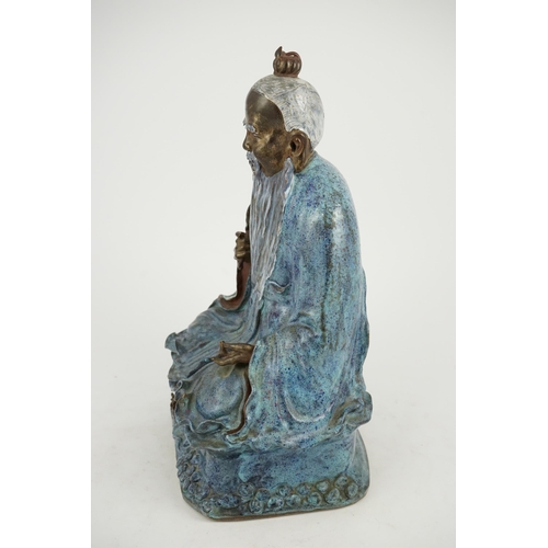 202 - An unusual large Chinese robins egg-glazed porcelain seated figure of Laozi, early 20th century, th... 