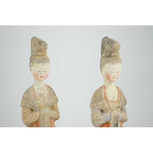 204 - A pair of Chinese Tang style painted pottery ladies, 44.5cm