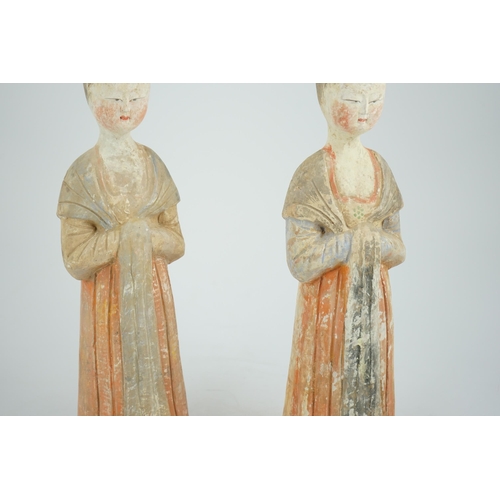 204 - A pair of Chinese Tang style painted pottery ladies, 44.5cm