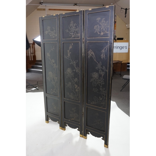 210 - A Chinese tixi lacquer and carved soapstone overlaid six panel screen, mid 20th century, relief deco... 