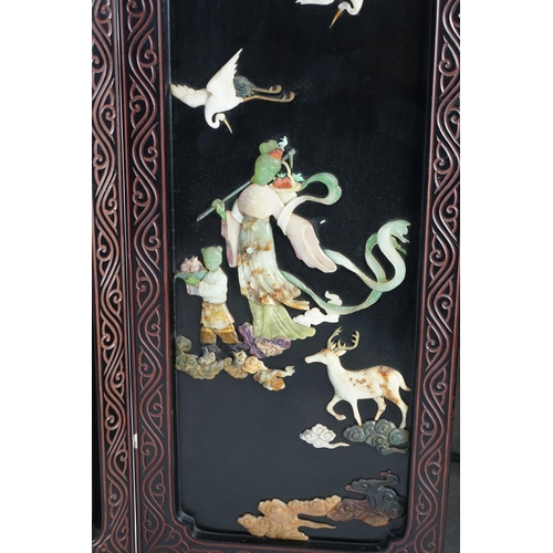 210 - A Chinese tixi lacquer and carved soapstone overlaid six panel screen, mid 20th century, relief deco... 