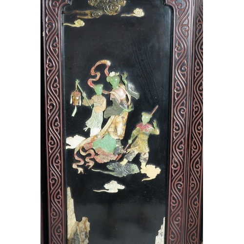 210 - A Chinese tixi lacquer and carved soapstone overlaid six panel screen, mid 20th century, relief deco... 