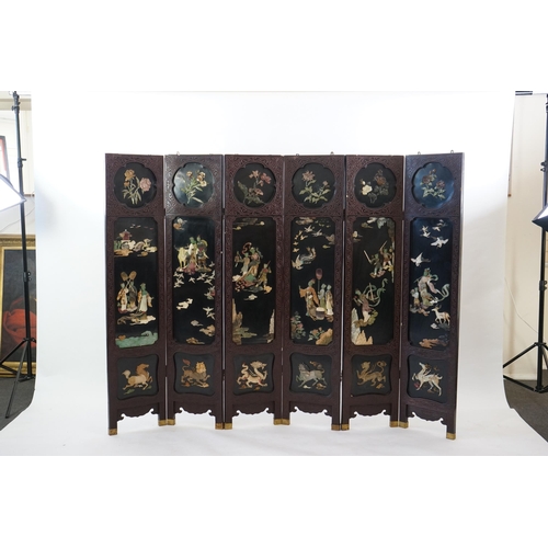 210 - A Chinese tixi lacquer and carved soapstone overlaid six panel screen, mid 20th century, relief deco... 