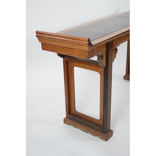 212 - A Chinese padouk wood and jichimu altar table, the panelled rectangular top with scroll ends, on pla... 