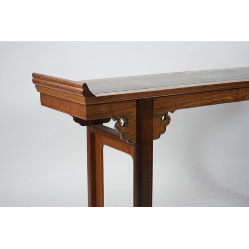 212 - A Chinese padouk wood and jichimu altar table, the panelled rectangular top with scroll ends, on pla... 