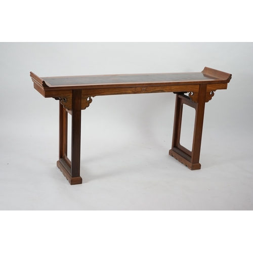 212 - A Chinese padouk wood and jichimu altar table, the panelled rectangular top with scroll ends, on pla... 