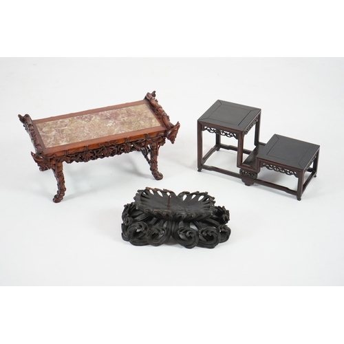 214 - Three Chinese carved wood stands, 19th/early 20th century the first a model of an altar table with m... 