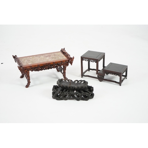 214 - Three Chinese carved wood stands, 19th/early 20th century the first a model of an altar table with m... 