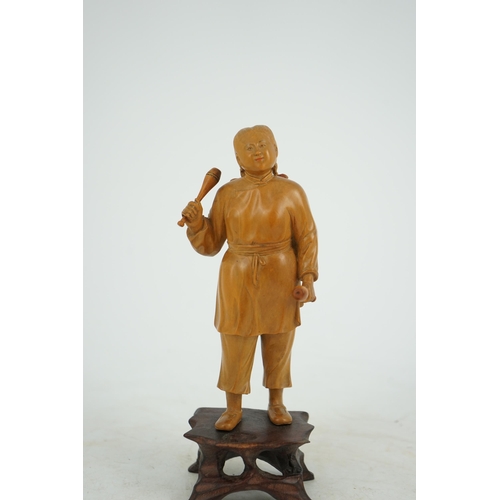 219 - A Chinese boxwood figure of a female juggler, attributed to Zhu Zichang (1876-1934), Republic period... 