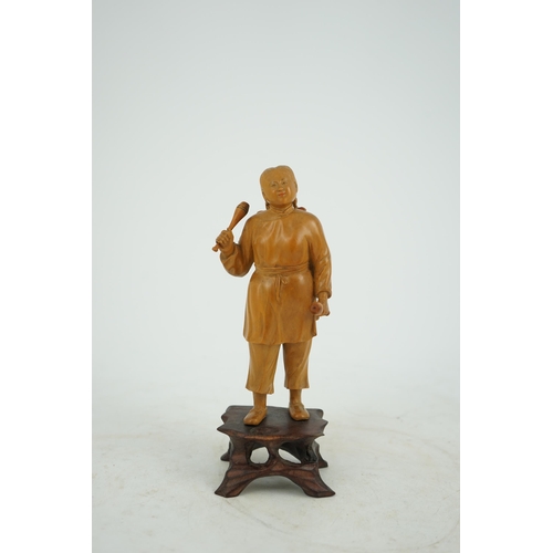 219 - A Chinese boxwood figure of a female juggler, attributed to Zhu Zichang (1876-1934), Republic period... 