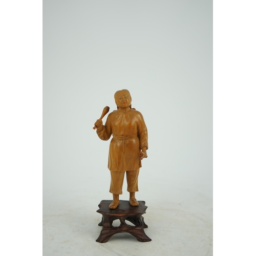 219 - A Chinese boxwood figure of a female juggler, attributed to Zhu Zichang (1876-1934), Republic period... 