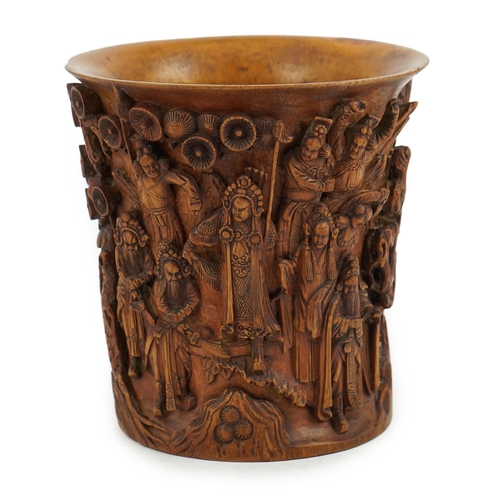 220 - A Chinese bamboo brush pot, 19th century, carved in high relief with a procession of dignitaries in ... 