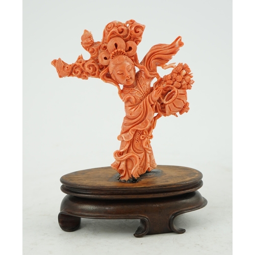 224 - A large Chinese coral carving of a flower fairy, mid 20th century, 14cm high, glued to wood stand... 