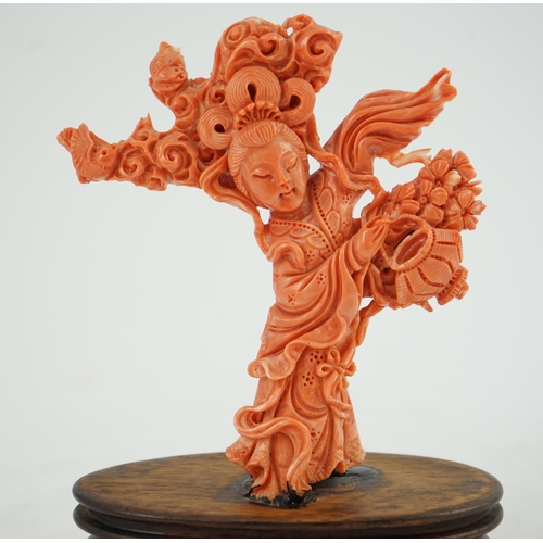 224 - A large Chinese coral carving of a flower fairy, mid 20th century, 14cm high, glued to wood stand... 