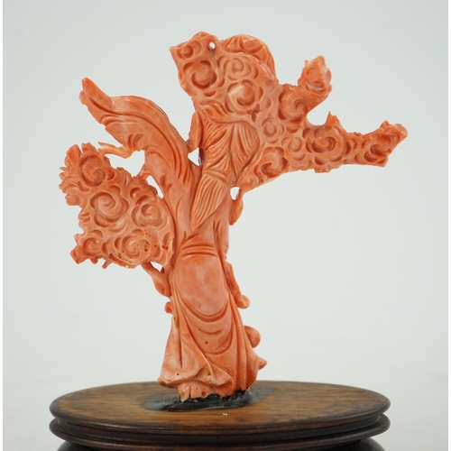 224 - A large Chinese coral carving of a flower fairy, mid 20th century, 14cm high, glued to wood stand... 