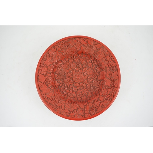 227 - An unusual Chinese cinnabar lacquer thousand flower footed dish, 18th/19th century, finely carved ... 