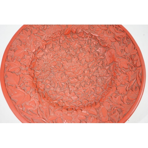 227 - An unusual Chinese cinnabar lacquer thousand flower footed dish, 18th/19th century, finely carved ... 