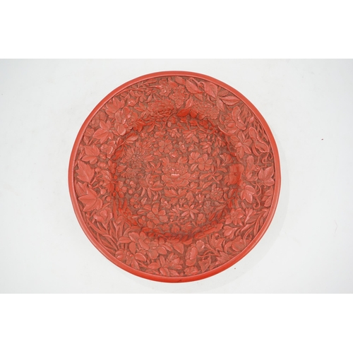 227 - An unusual Chinese cinnabar lacquer thousand flower footed dish, 18th/19th century, finely carved ... 