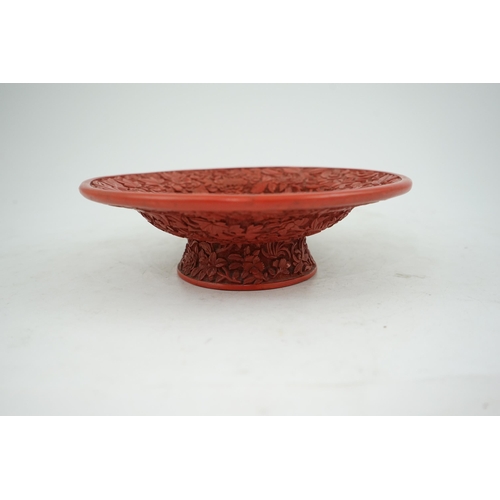 227 - An unusual Chinese cinnabar lacquer thousand flower footed dish, 18th/19th century, finely carved ... 