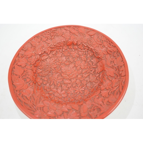 227 - An unusual Chinese cinnabar lacquer thousand flower footed dish, 18th/19th century, finely carved ... 