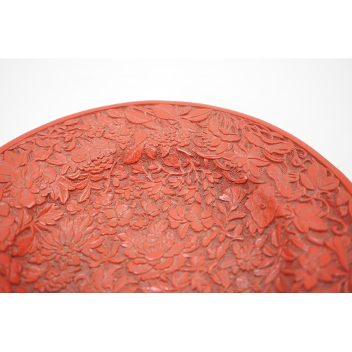 227 - An unusual Chinese cinnabar lacquer thousand flower footed dish, 18th/19th century, finely carved ... 