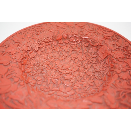 227 - An unusual Chinese cinnabar lacquer thousand flower footed dish, 18th/19th century, finely carved ... 