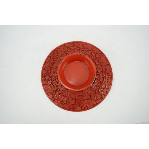 227 - An unusual Chinese cinnabar lacquer thousand flower footed dish, 18th/19th century, finely carved ... 