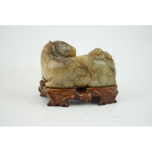 234 - A Chinese celadon and mottled brown jade figure of a monkey climbing on a recumbent horse, Ming dyna... 